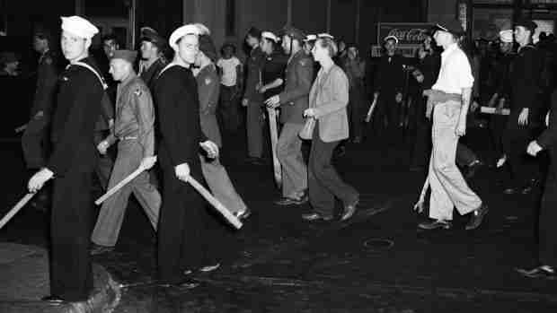 Armed with clubs, pipes and bottles, this self-appointed posse of uniformed men was all set to settle the Zoot Suit War when the Navy Shore Patrol stepped in and broke it up.