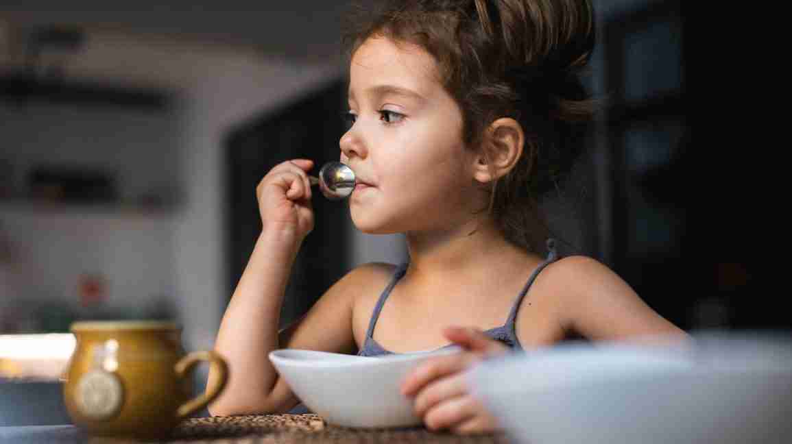 A child eating breakfast