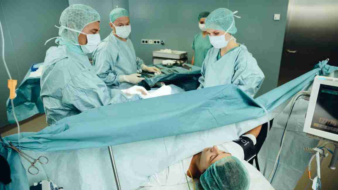 doctors performing c-section delivery