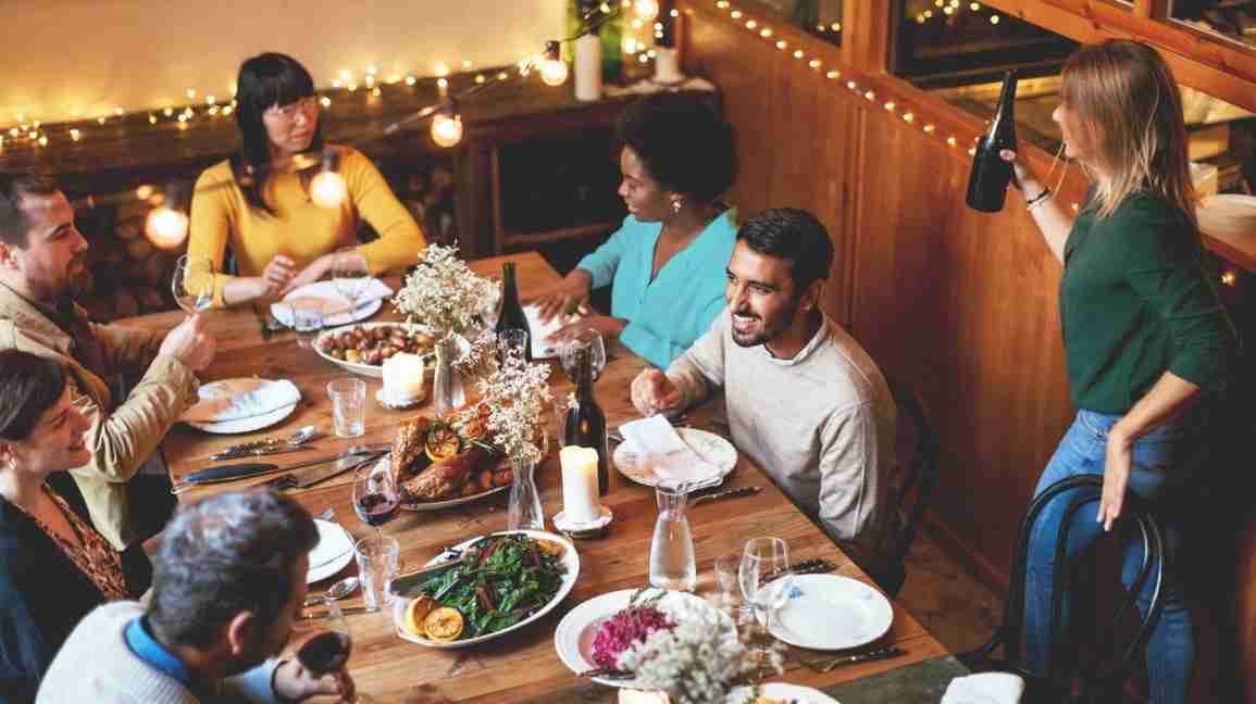 a family around the table for a holiday dinner