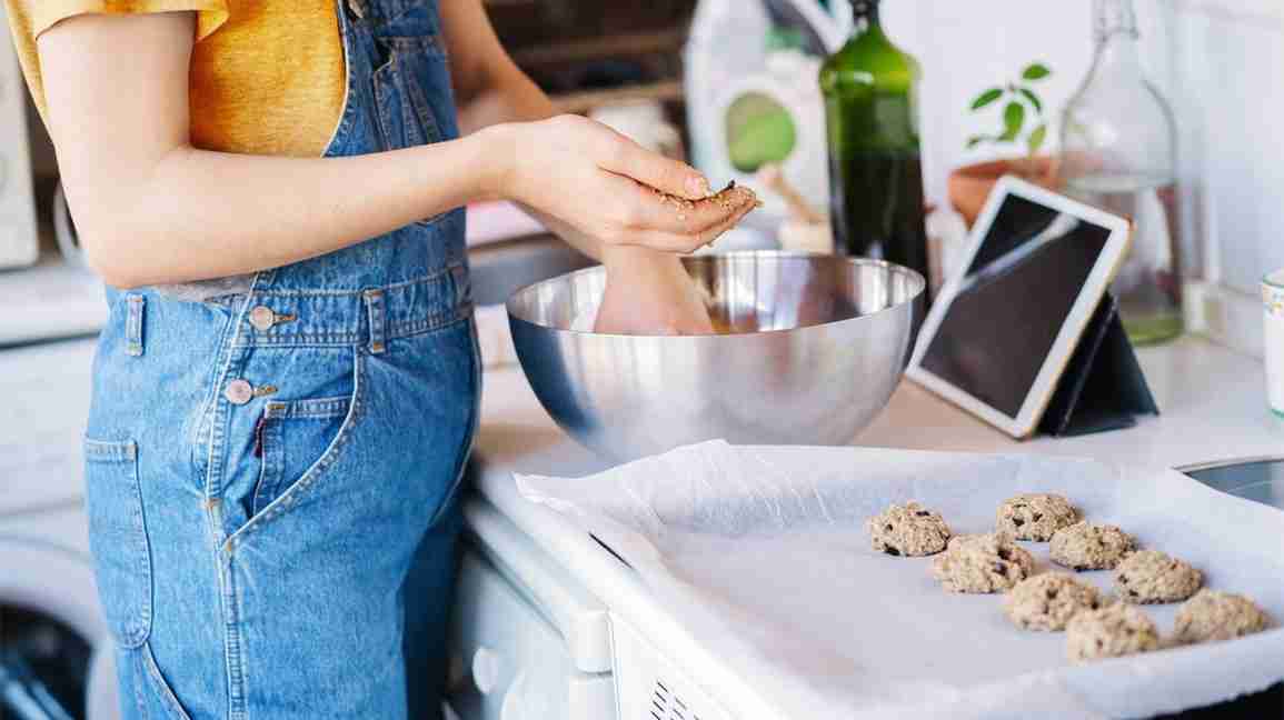 woman cooking lactation recipes in the kitchen