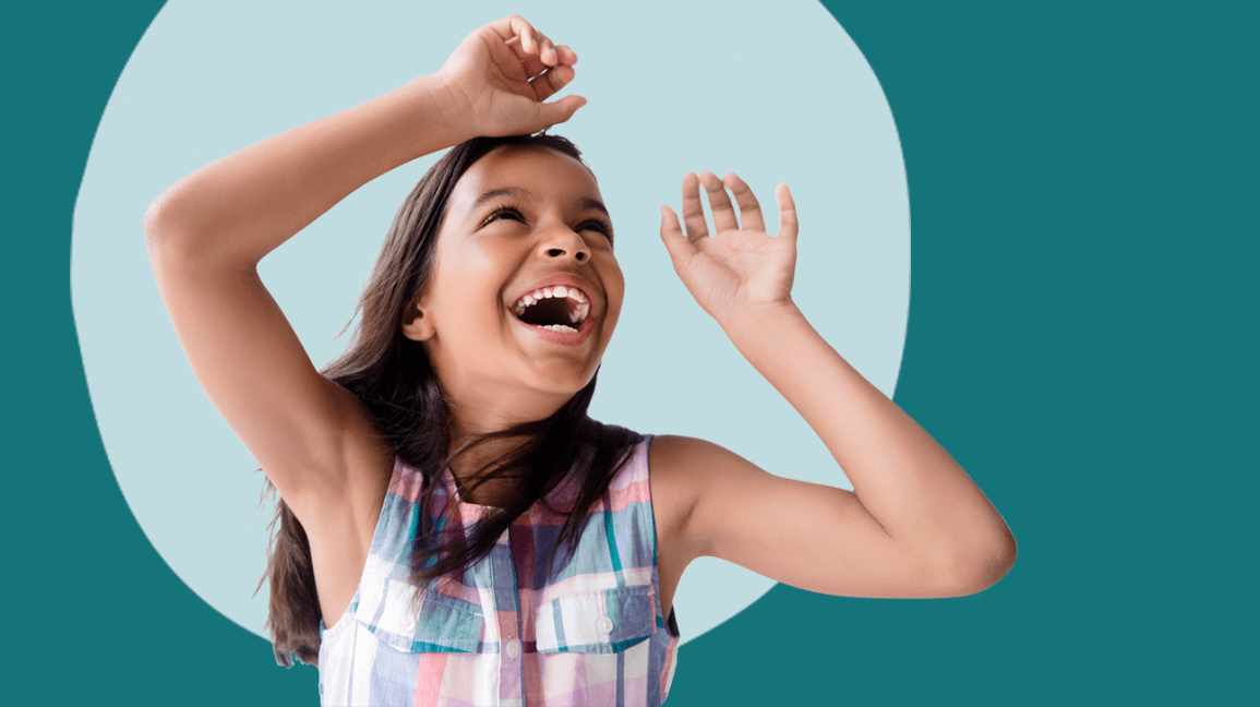 A young girl playing with her arms in the air