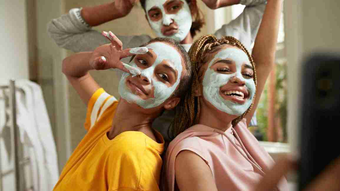 three friends doing face masks