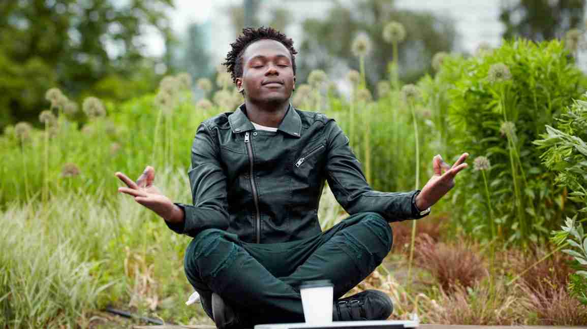 man practicing mantra meditation outside