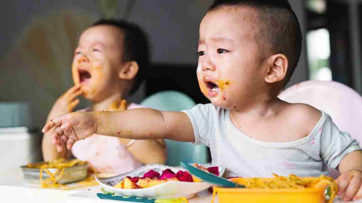 twins crying during meal