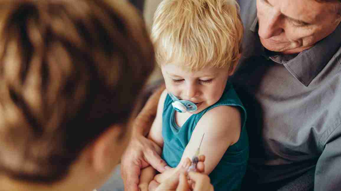 Toddler getting a vaccine after learning about aVaccine Schedule for Infants and Toddlers