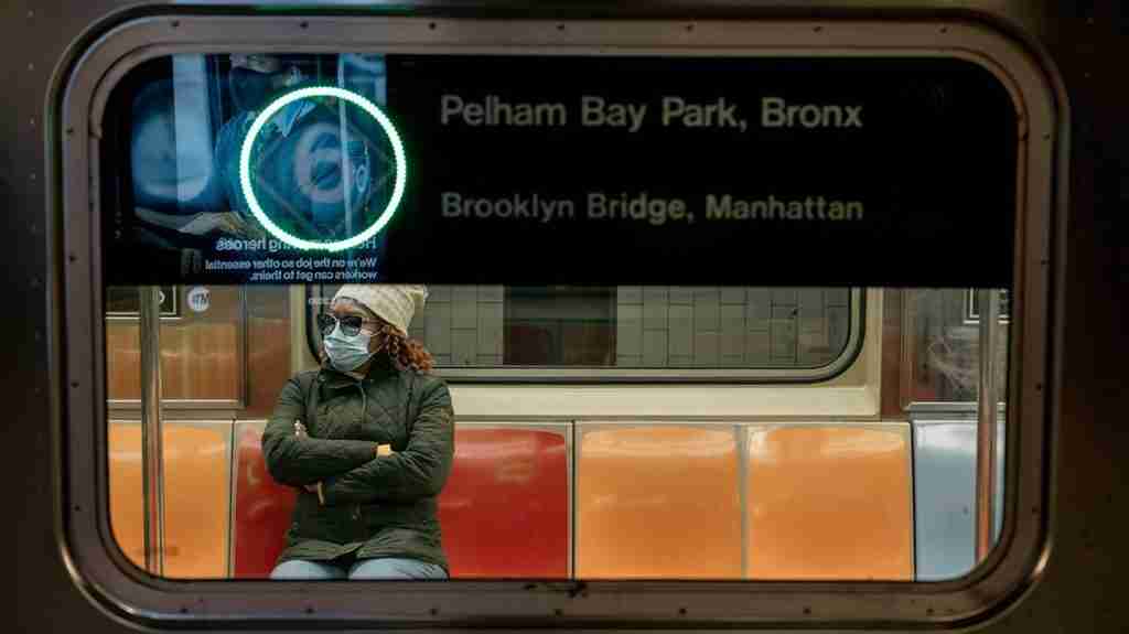 NEW YORK, NY - APRIL 17: A commuter wears a face mask while riding a subway train on April 17, 2020 in New York City. Following a new order from Governor Andrew Cuomo that New Yorkers must wear face coverings whenever social distancing is not possible, the measure is the latest in a series of communal steps taken to stop the spread of the deadly coronavirus (COVID-19). (Photo by Scott Heins/Getty Images)