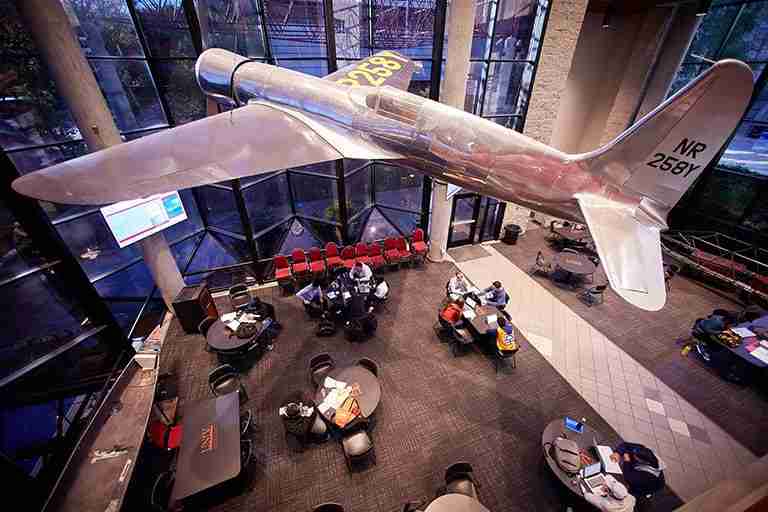 Airplane hangs in building lobby
