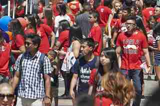 Crowd of students wearing red U-N-L-V shirts.